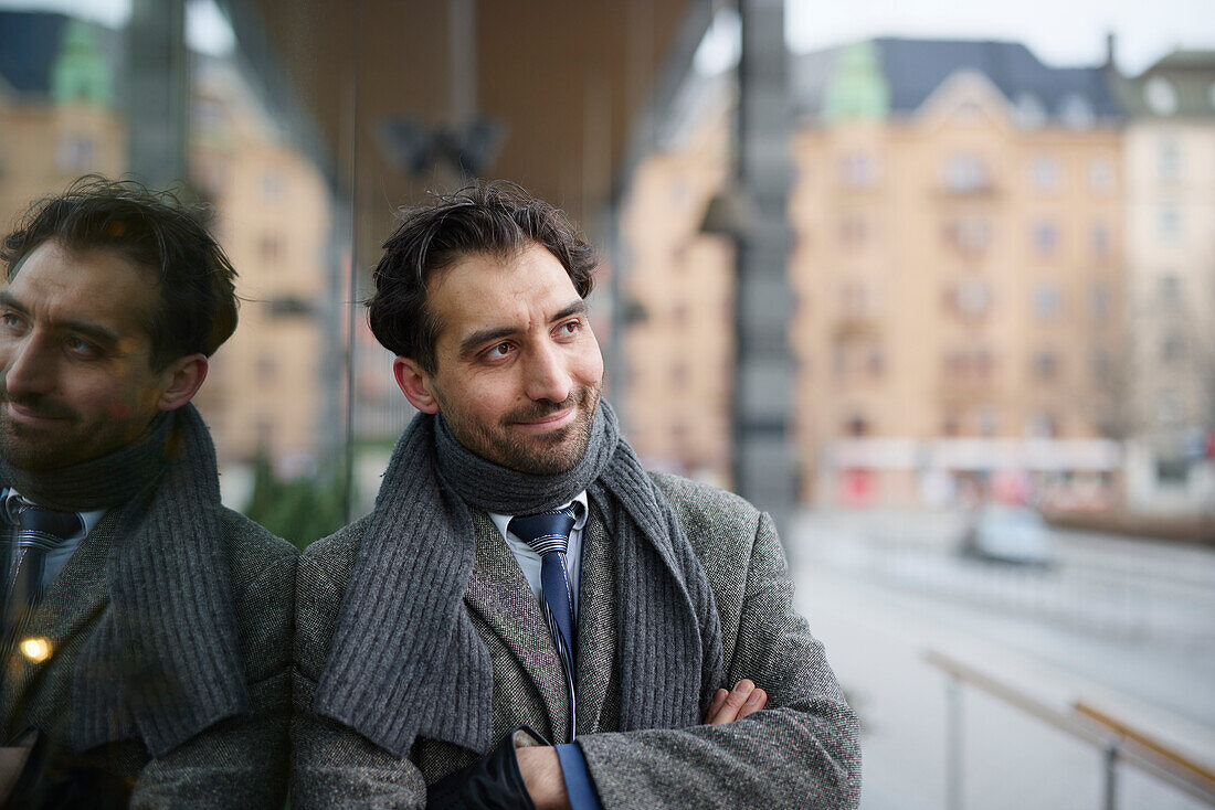 Smiling mid adult businessman standing outdoors