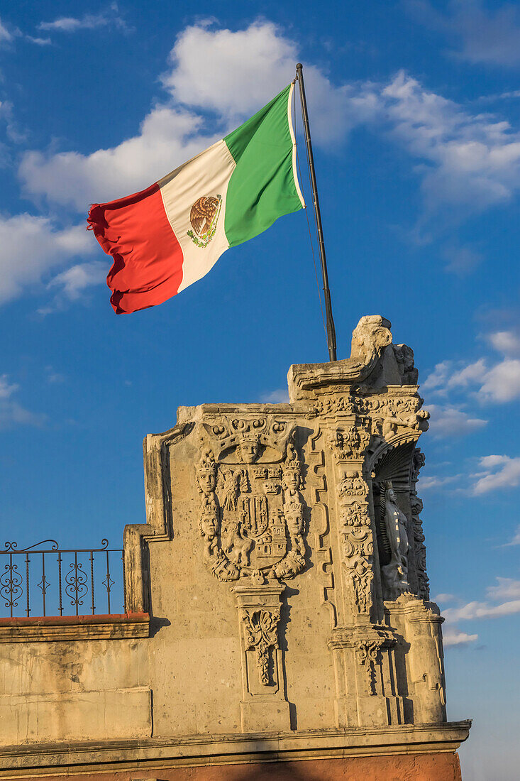 Mexican Flag and statues, Zocalo, Mexico City, Mexico.
