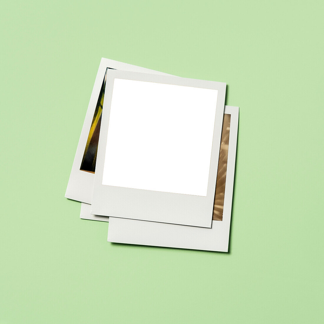 Stack of instant pictures with blank on top