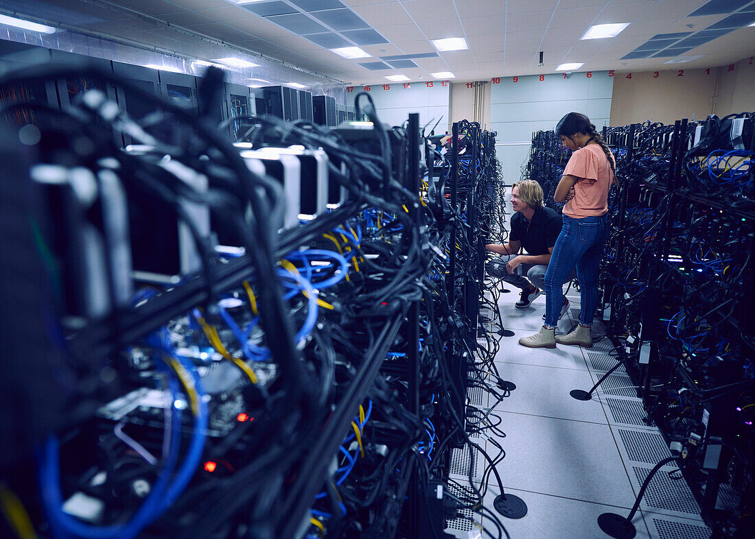 Technicians working in server room