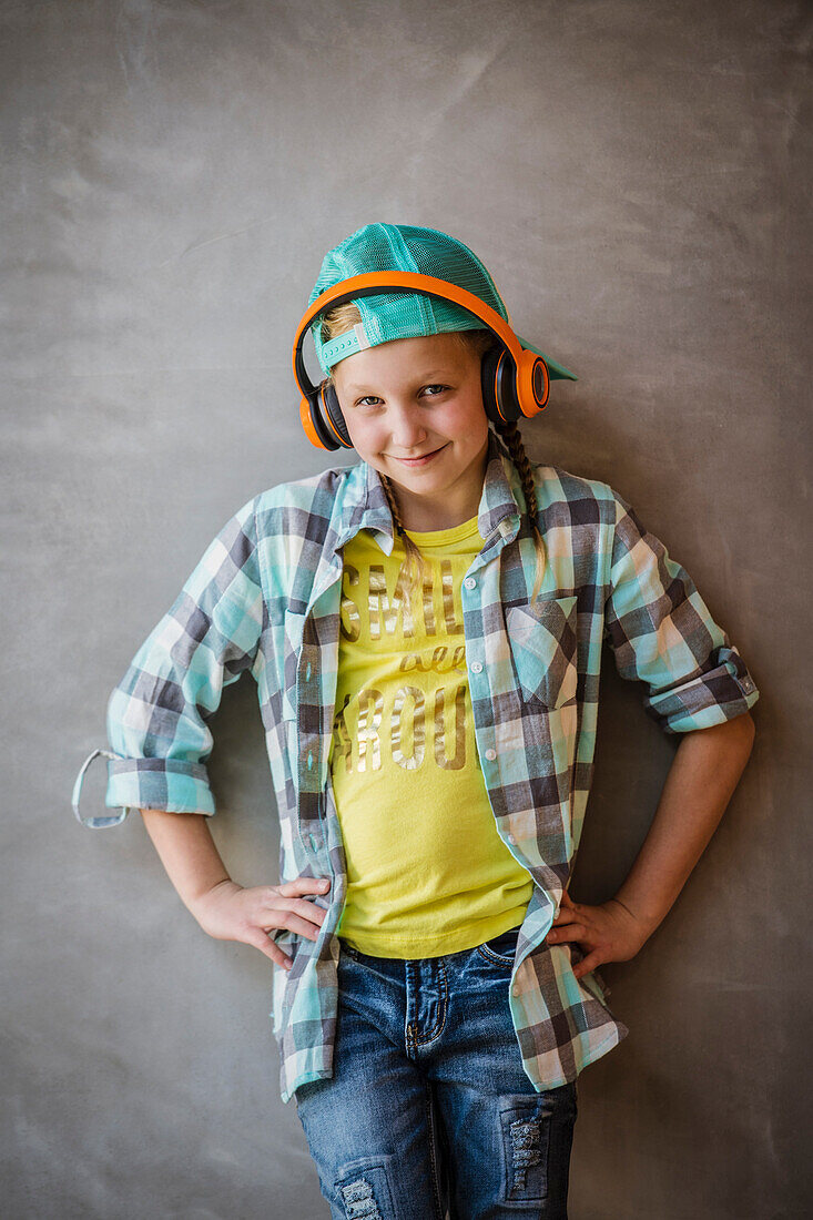 Portrait of smiling girl (10-11) withe headphones