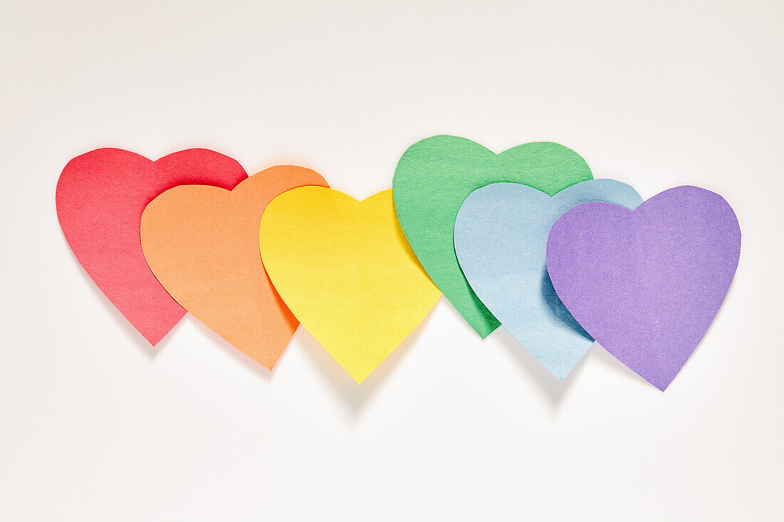 Studio shot of row of rainbow color Paper hearts