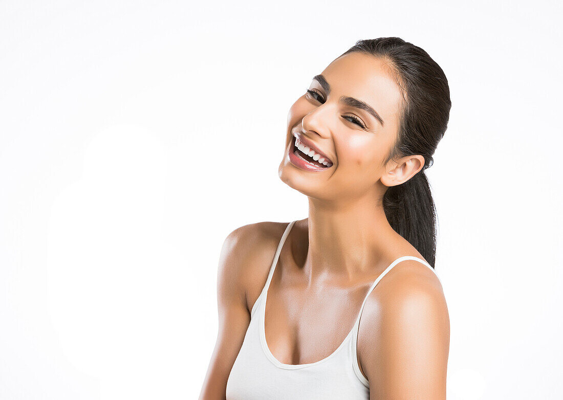 Portrait of smiling young woman looking at camera