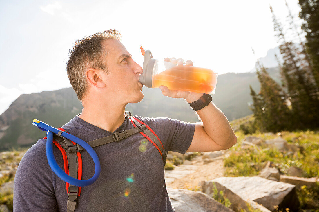 United States, Utah, Alpine, Male hiker drinking from bottle