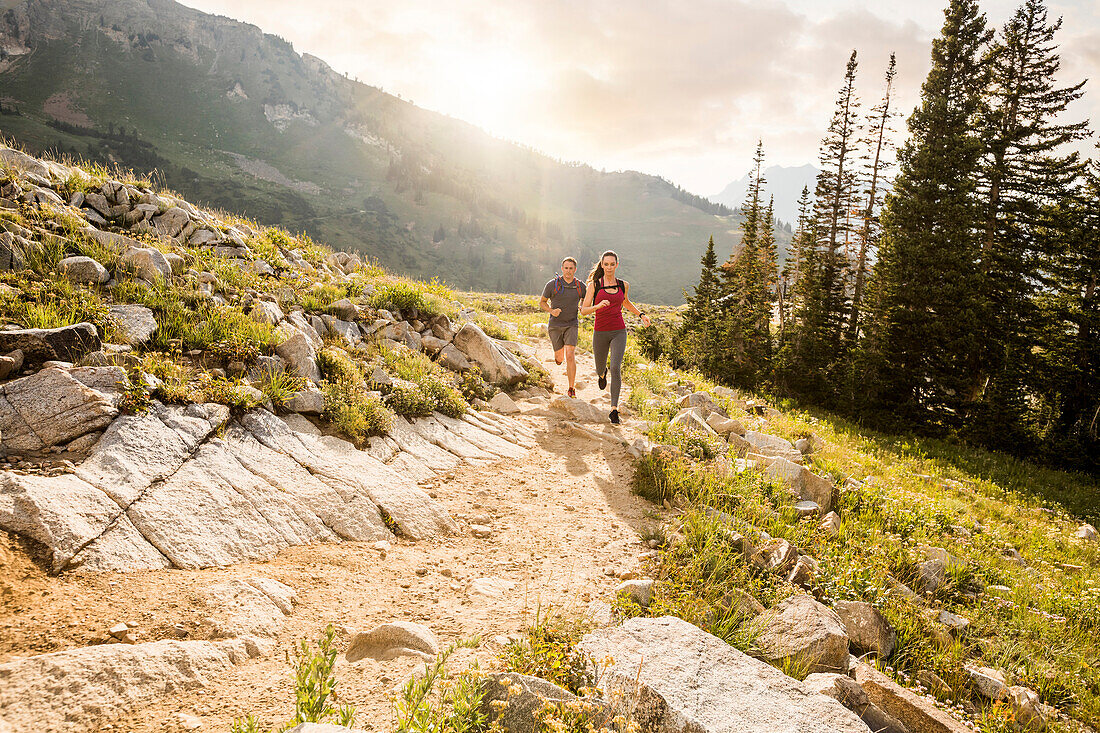 United States, Utah, Alpine, Couple jogging in mountains