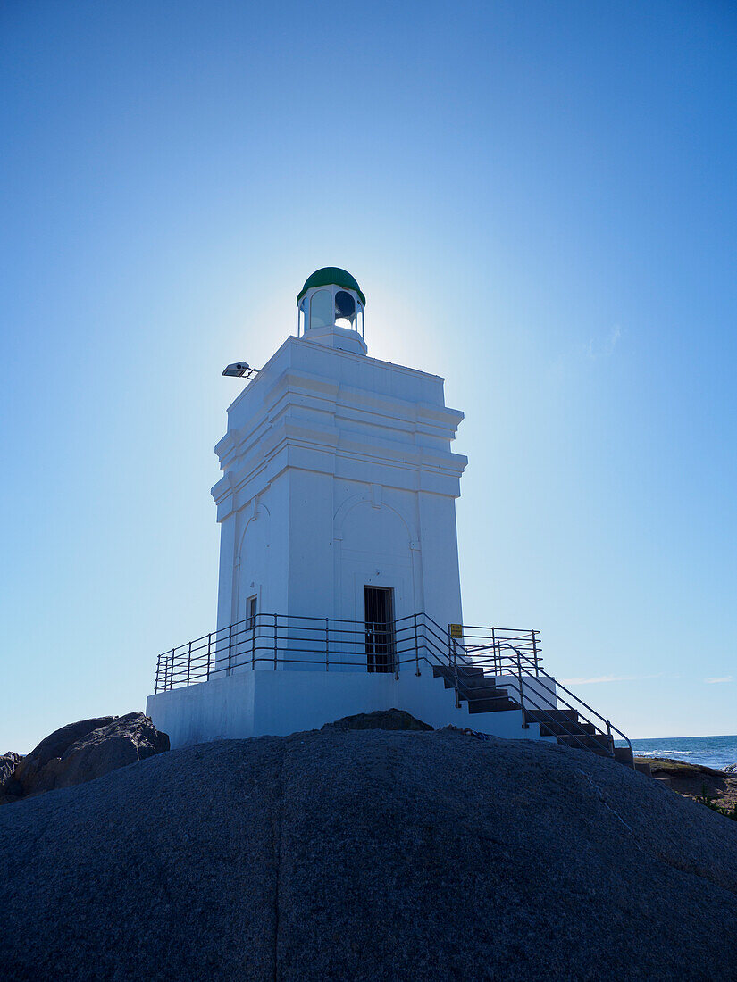South Africa, Western Cape, St Helena, White lighthouse on sea coast