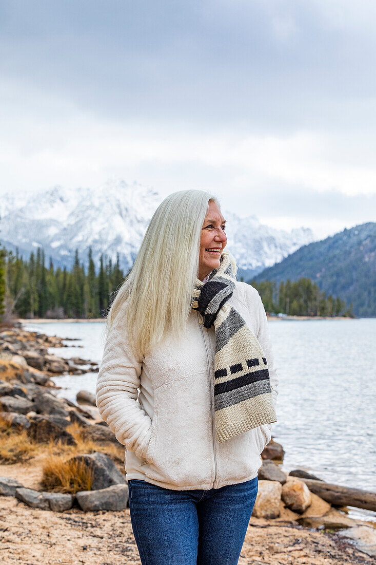 USA, Idaho, Stanley, Smiling senior woman at mountain lake