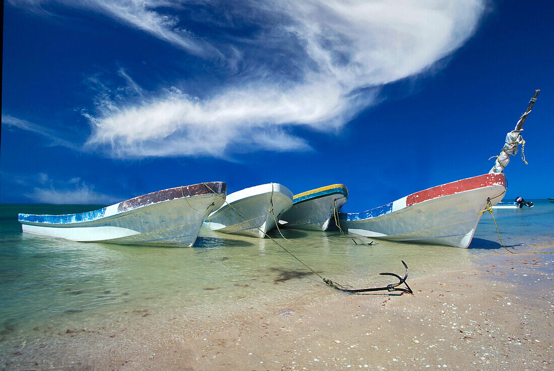 Mexico, Cancun, Yucatan, Traditional fishing boats on Caribbean beach