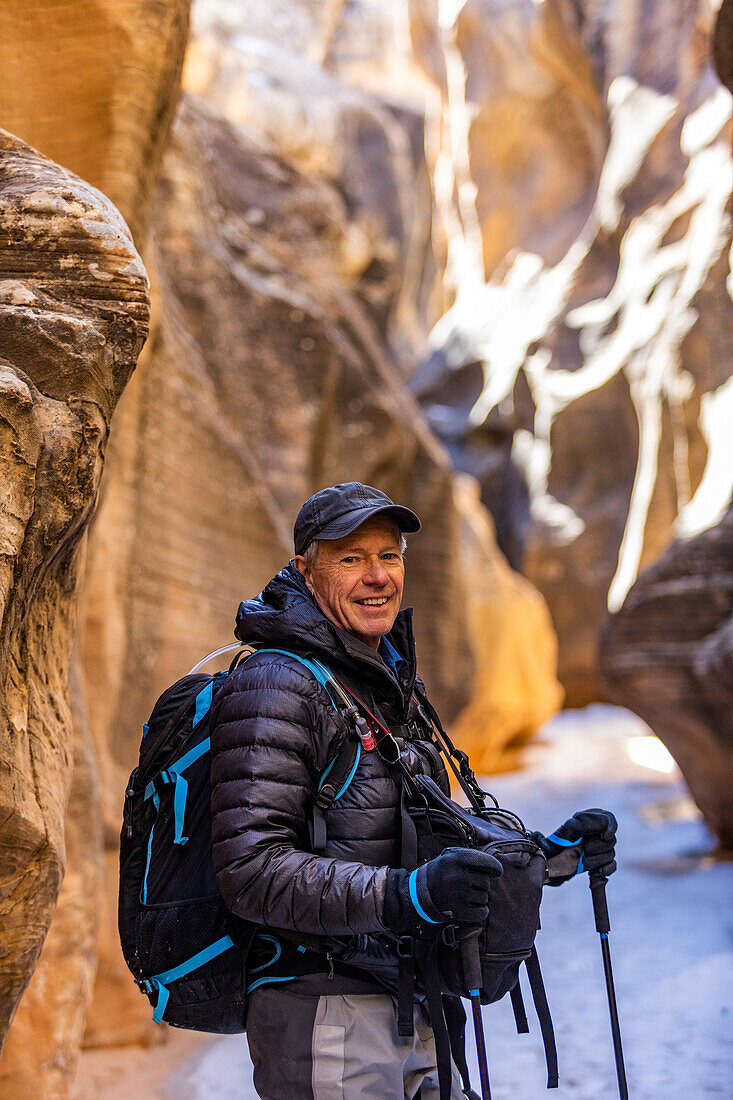 USA, Utah, Escalante, Man hiking in slot canyon in Grand Staircase-Escalante National Monument