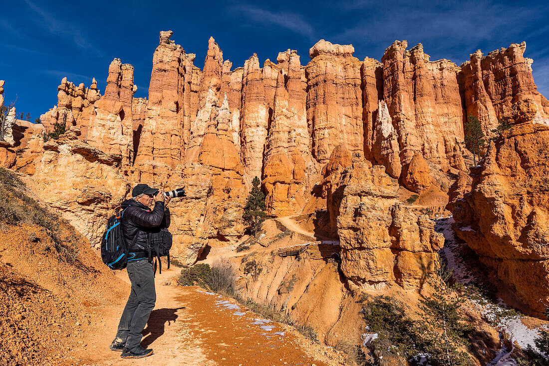 United States, Utah, Senior photographer photographing in Zion National Park