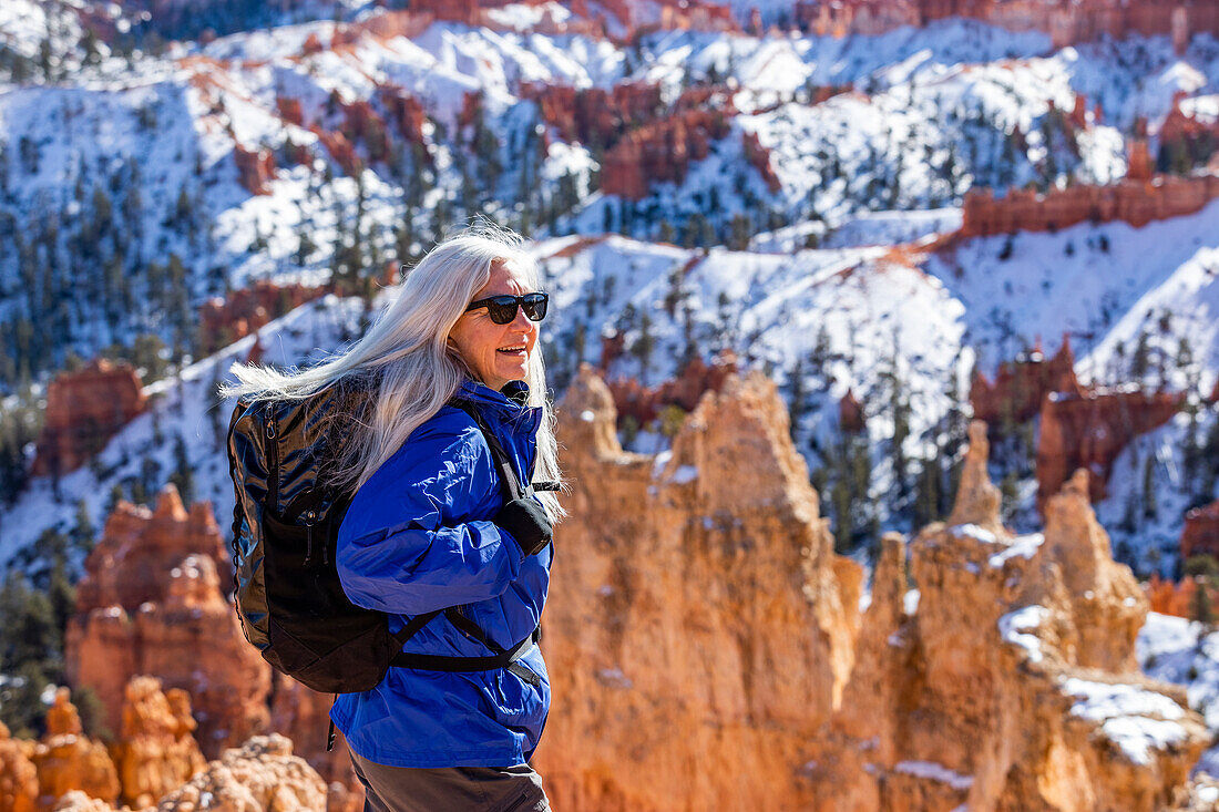 United States, Utah, Bryce Canyon National Park, Senior blonde woman hiking