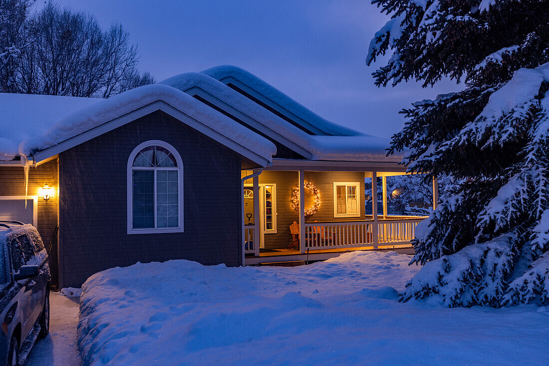 United States, Idaho, Bellevue, Snow covered house with porch lights
