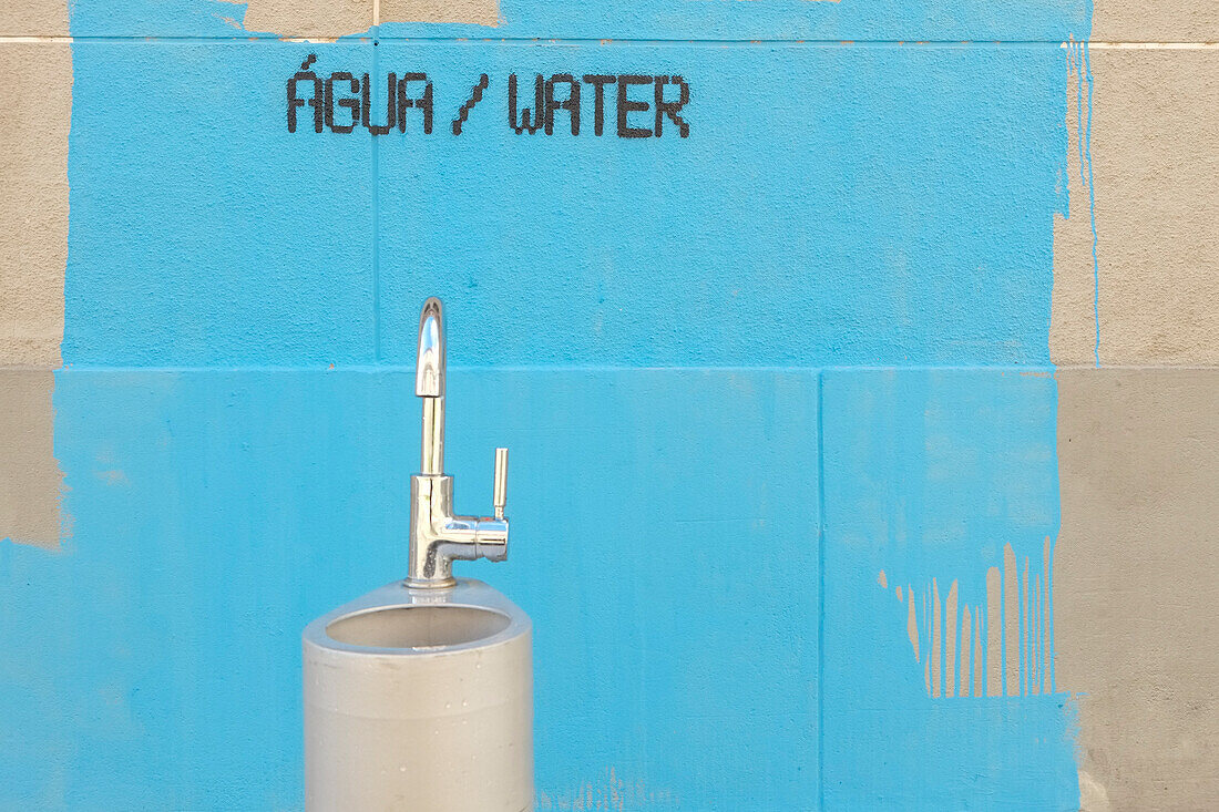 Water fountain and painting on wall