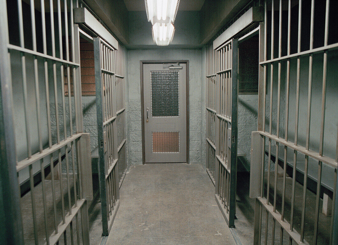 Row of empty prison cells