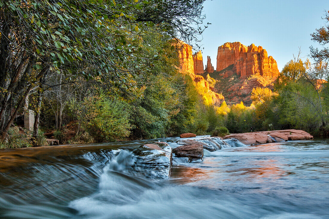 USA, Arizona, Sedona, Red Rock Crossing. Flowing water with rock and trees