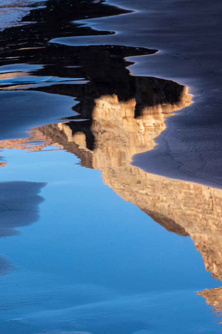 USA, Arizona. Canyon wall reflections on a sand beach, Grand Canyon National Park.