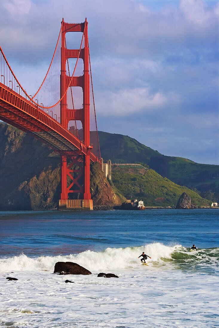 USA, California, San Francisco. Surfers below the Golden Gate Bridge
