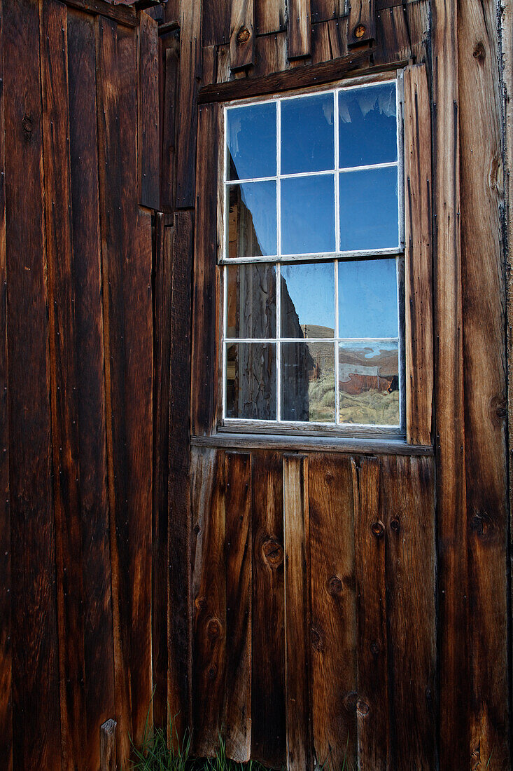USA, California, Bodie State Historic Park. Weathered window in abandoned town