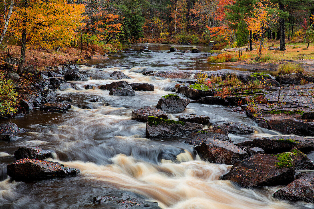 The Middle Branch of the Escanaba River Rapids in autumn near Palmer, Michigan USA