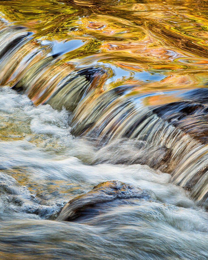 USA, Michigan, Upper Peninsula, Bond River with autumn reflections abstract. NOTE: No usage in 2023 Calendars.