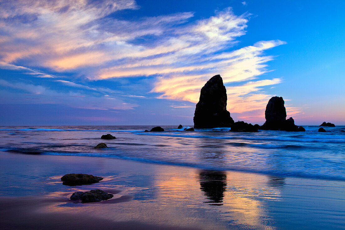 USA, Oregon. Cannon Beach at sunset low tide