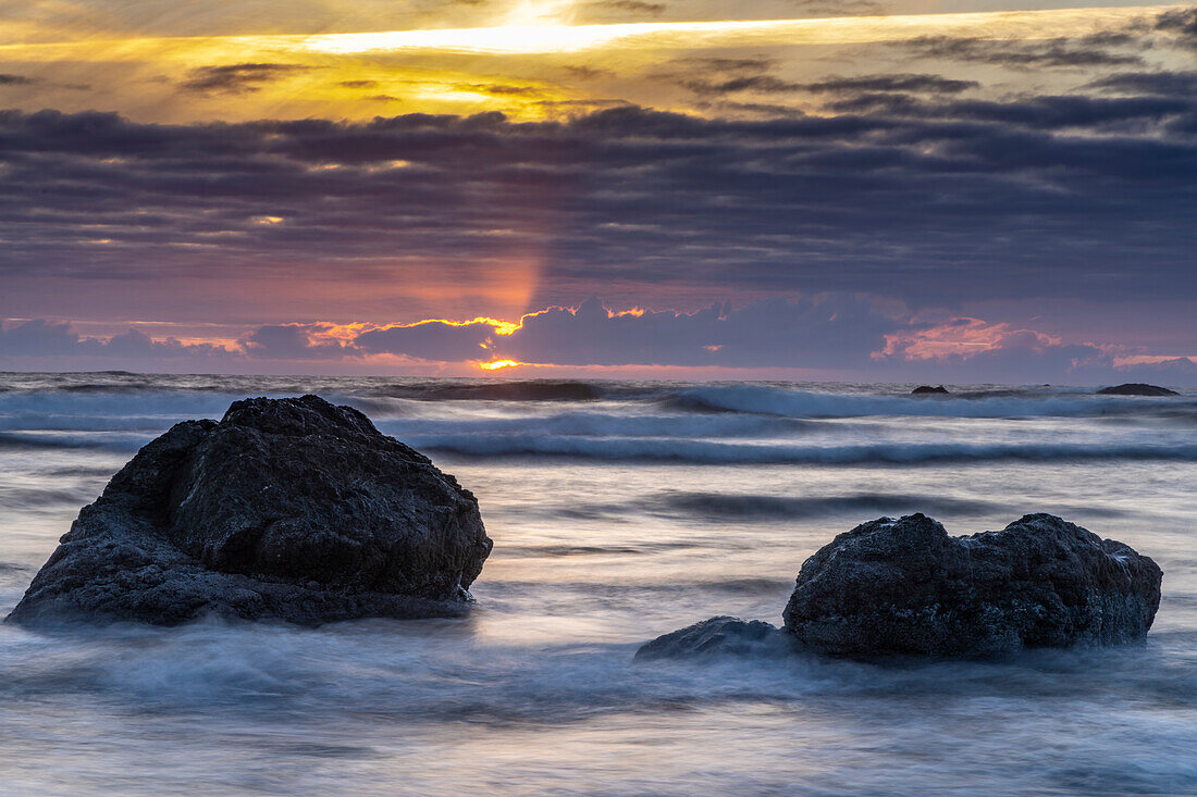 USA, Oregon, Bandon Beach. Pacific Ocean shoreline at sunset.