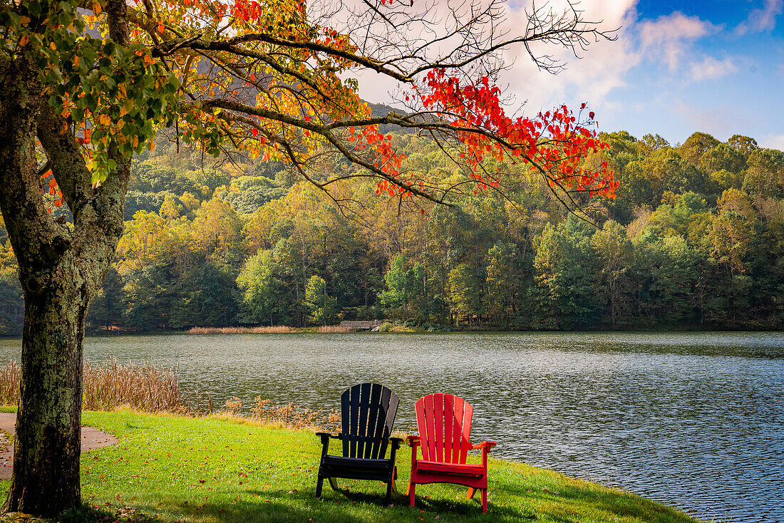 Colorful chairs on the banks of the lake, Peaks Of Otter, Blue Ridge Parkway, Smoky Mountains, USA.