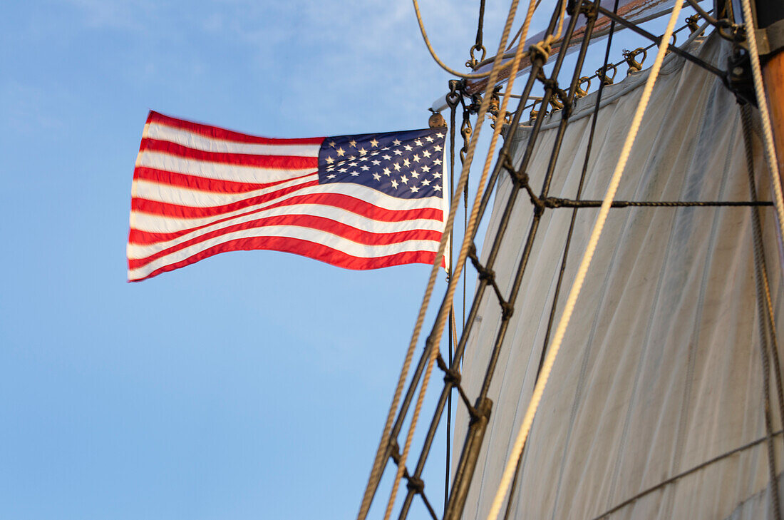 United States flag flying on Hawaiian Chieftain, a Square Topsail Ketch. Owned and operated by the Grays Harbor Historical Seaport, Aberdeen, Washington State
