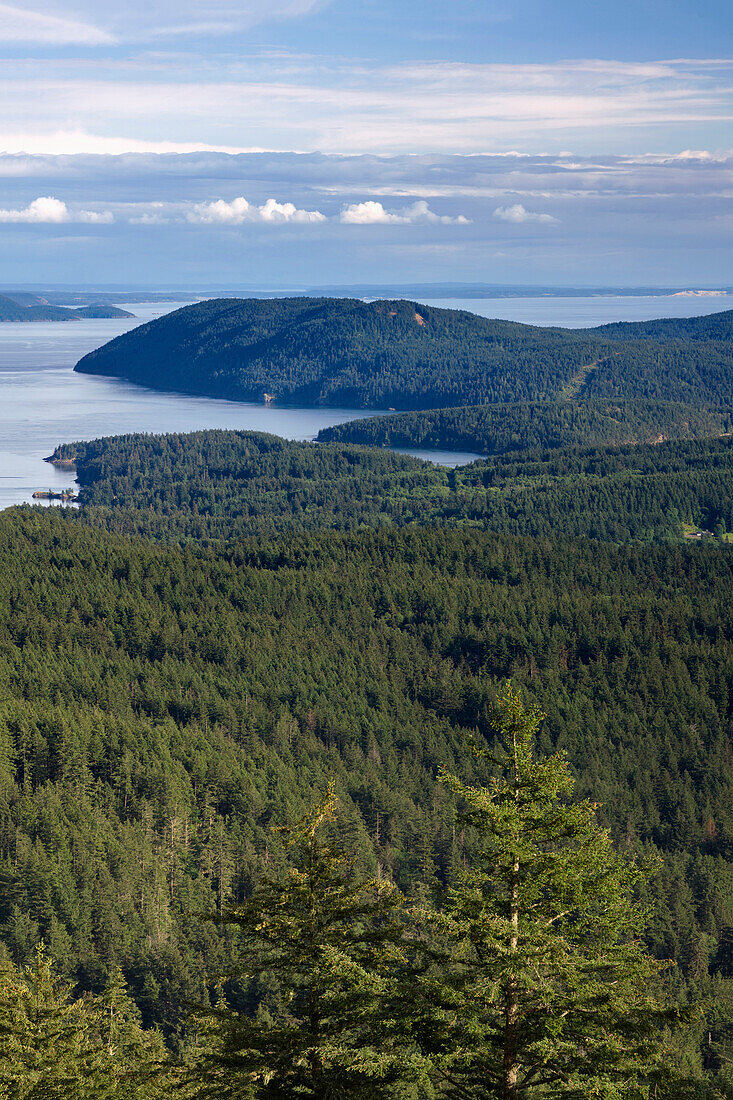 USA, Washington State, San Juan Islands, View south from Little Summit in Moran State Park on Orcas Island towards Obstruction Island and Blakely Island reveals dense forest.