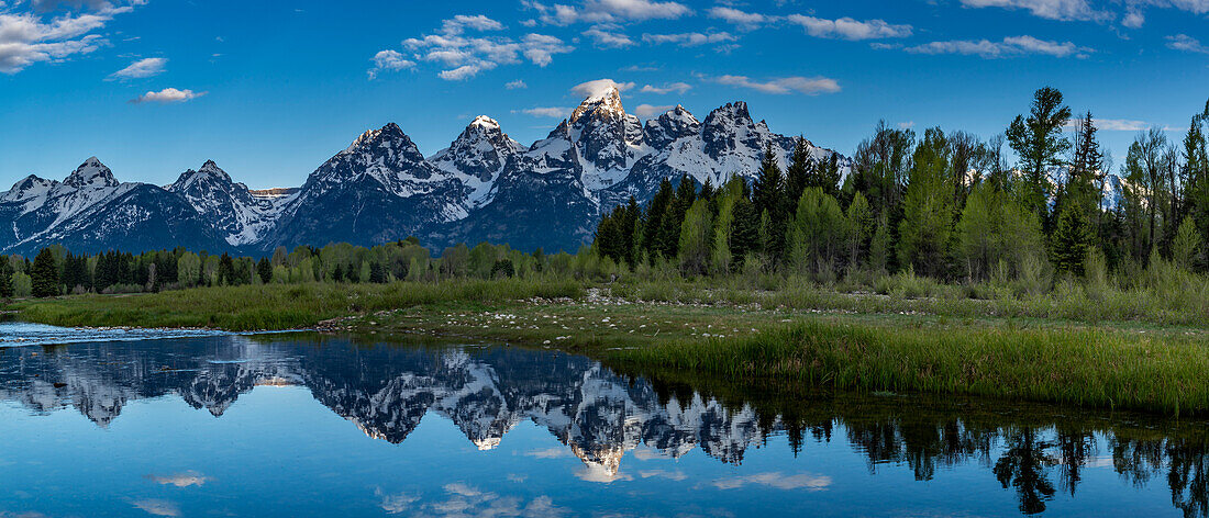 Grand Teton National Park, panoramic reflection of Teton Mountains near Jackson Hole, Wyoming