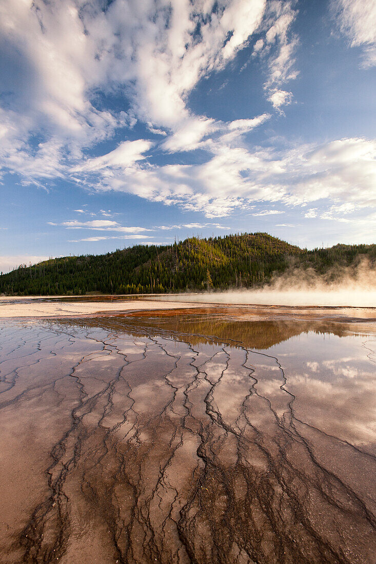 Cloud reflections over chemical Sediments. Yellowstone National Park, Wyoming.