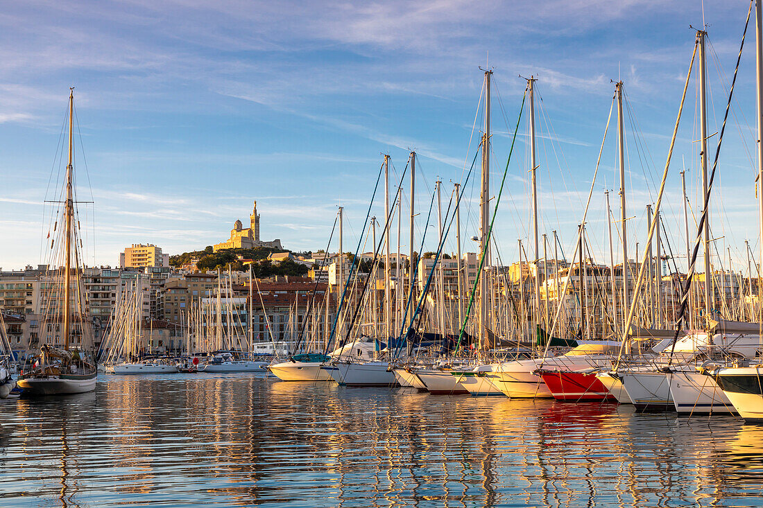 Marseille Harbour and Notre-Dame de la Garde at sunrise, Marseille, Bouches-du-Rhone, Provence-Alpes-Cote d'Azur, France, Western Europe