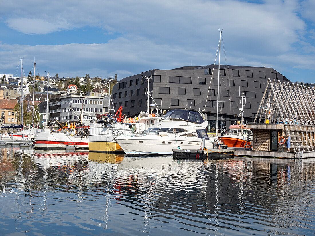 A view of the water front in the city of Tromso, located 217 miles north of the Arctic Circle, Tromso, Norway, Scandinavia, Europe