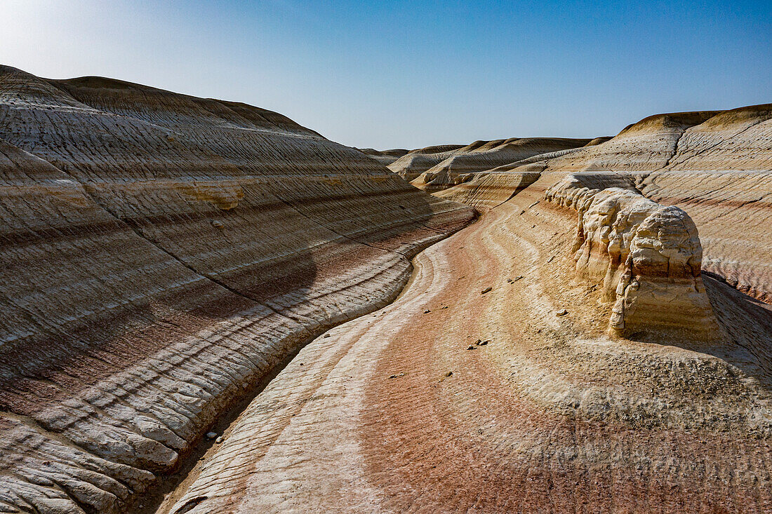 Aerial of multicoloured layers of sandstone, Kyzylkup, Mangystau, Kazakhstan, Central Asia, Asia