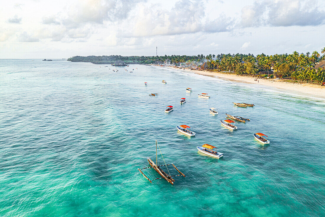 Aerial view of traditional dhow boats in the crystal sea, Pingwe, Michamvi, Zanzibar, Tanzania, East Africa, Africa