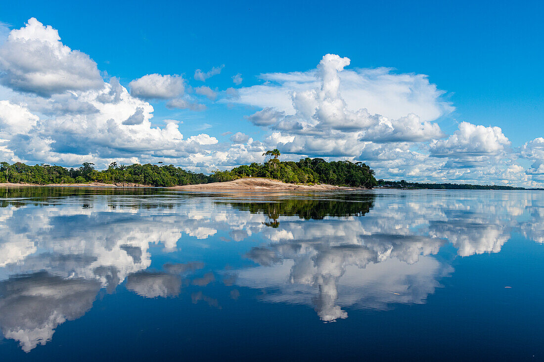 Clouds reflecting in the Rio Negro, southern Venezuela, South America