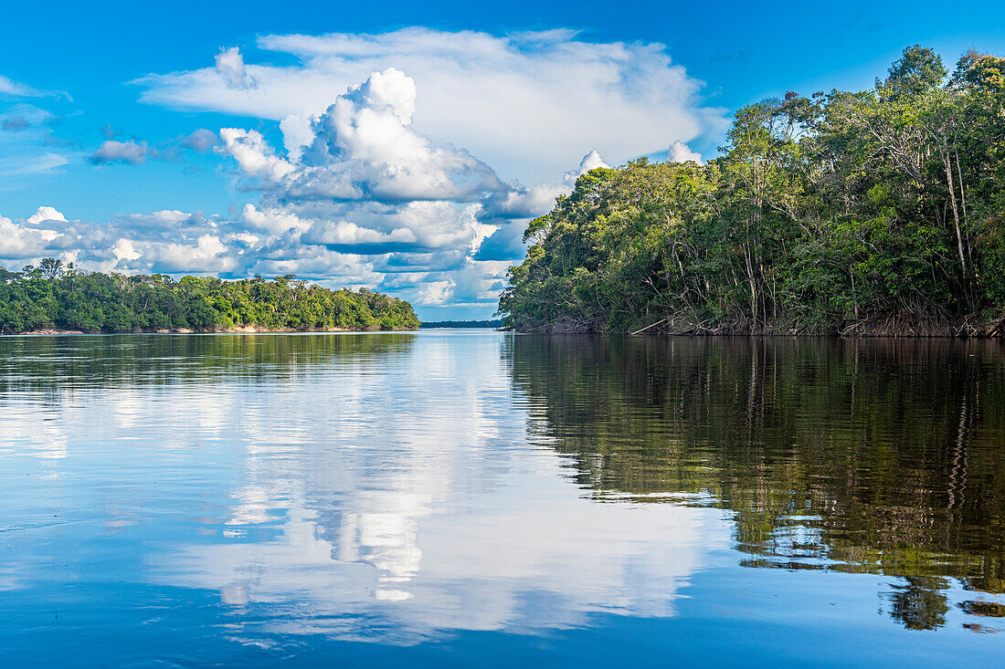 Clouds reflecting in the Rio Negro, southern Venezuela, South America