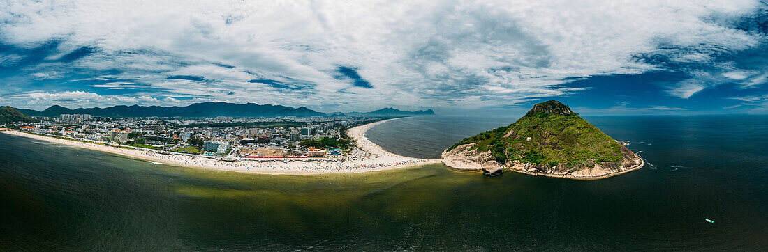 Aerial panoramic view of Pedra do Pontal, which divides Praia de Sernambetiba and Praia do Recreio, Rio de Janeiro, Brazil, South America