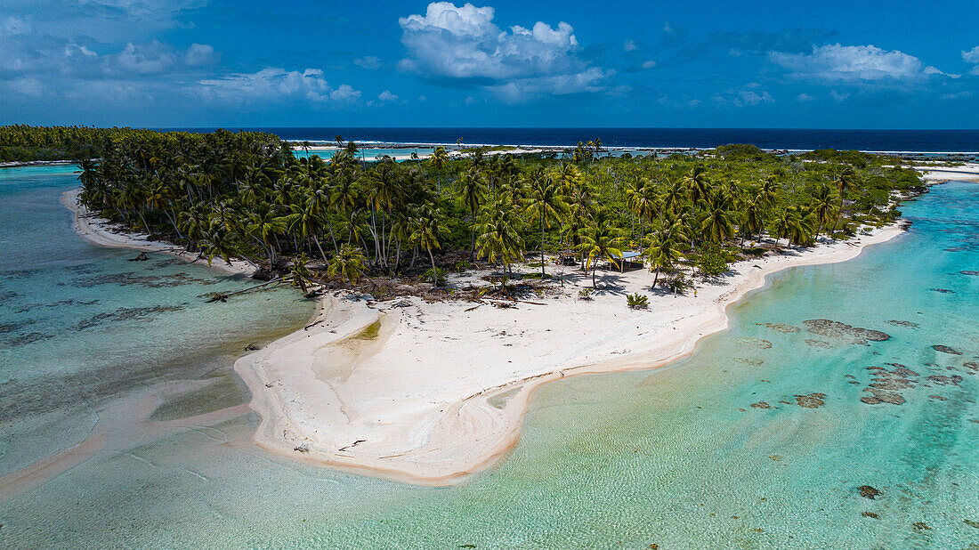 Aerial of little island with white sand beach, the Ile aux Recifs, Rangiroa atoll, Tuamotus, French Polynesia, South Pacific, Pacific