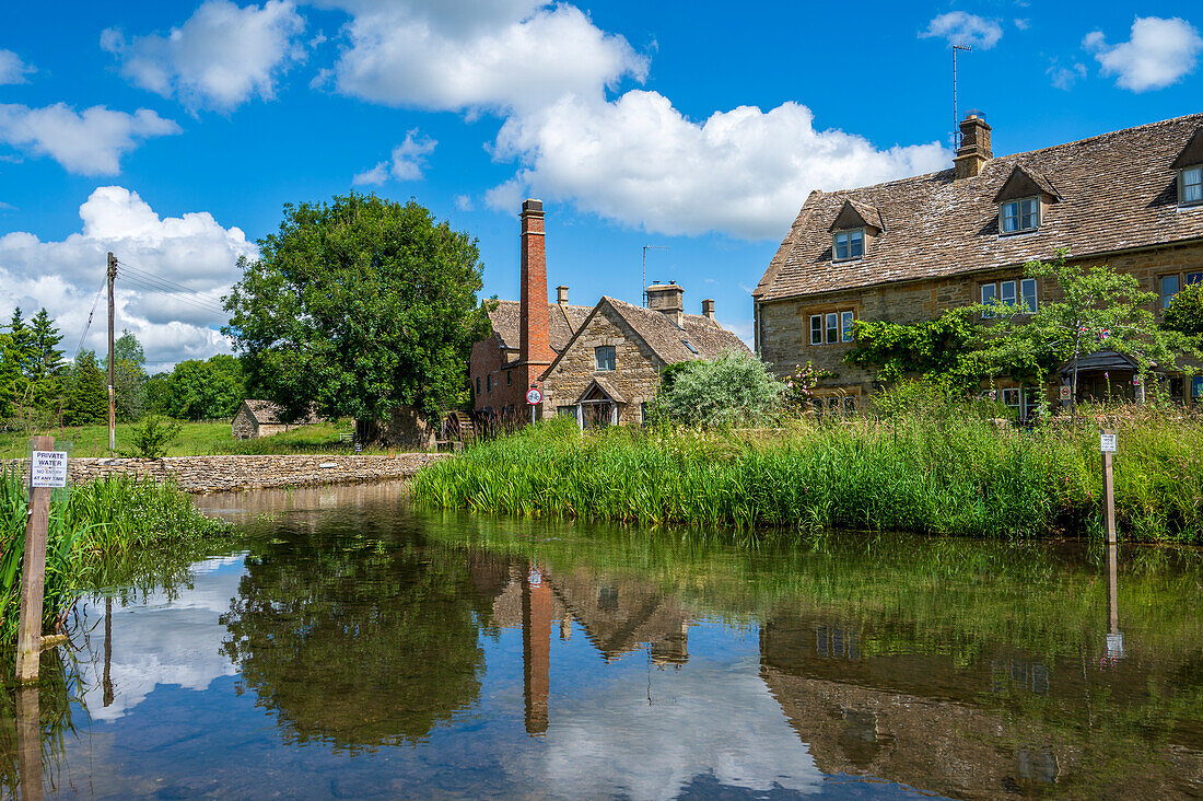 Mill and cottages on River Eye, Lower Slaughter, Cotswolds, Gloucestershire, England, United Kingdom, Europe