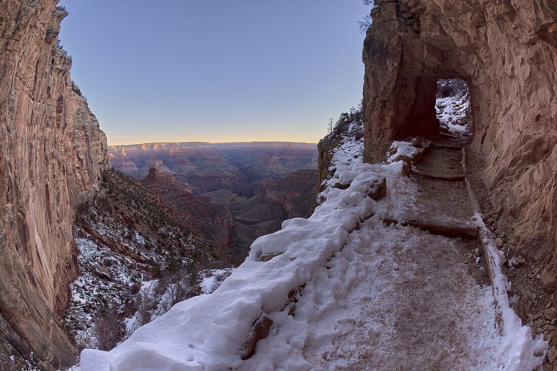 The second tunnel along Bright Angel Trail in winter at sunrise on the South Rim of Grand Canyon, Grand Canyon National Park, UNESCO World Heritage Site, Arizona, United States of America, North America
