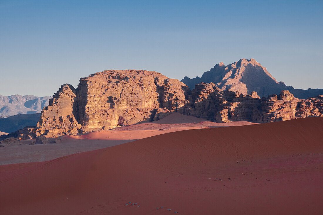 Morning light on mountains over the red sand dune of Wadi Rum, UNESCO World Heritage Site, Jordan, Middle East