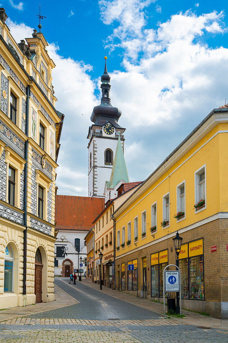 Street leading to Church of the Nativity of the Blessed Virgin Mary on sunny day, Pisek, South Bohemian Region, Czech Republic (Czechia), Europe