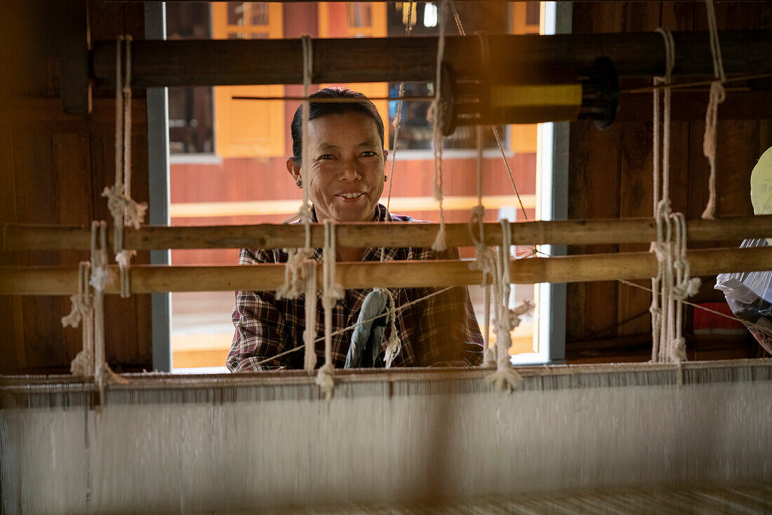 Burmese woman working on loom at workshop, Lake Inle, Shan State, Myanmar (Burma), Asia