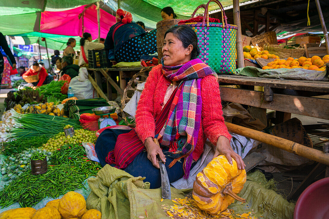 Burmese woman selling fruits and vegetables at local market, Lake Inle, Nyaungshwe, Shan State, Myanmar (Burma), Asia