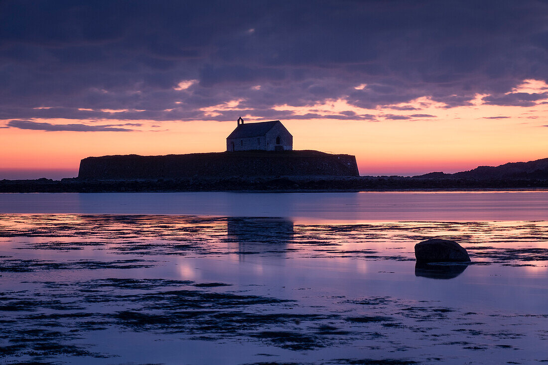 St. Cwyfan's Church (Church in the Sea) on the island of Cribinau at sunset, near Aberffraw, Anglesey, North Wales, United Kingdom, Europe