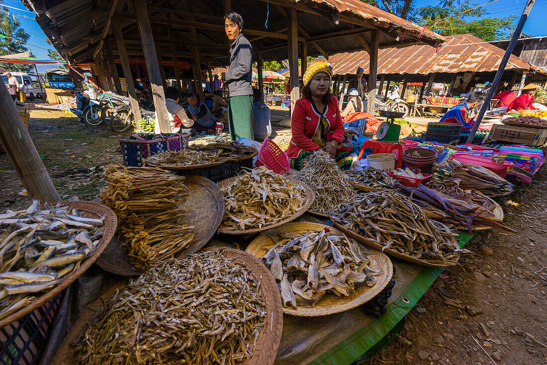 Vendors selling dried fish at market, Inn Thein, Lake Inle, Shan State, Myanmar (Burma), Asia
