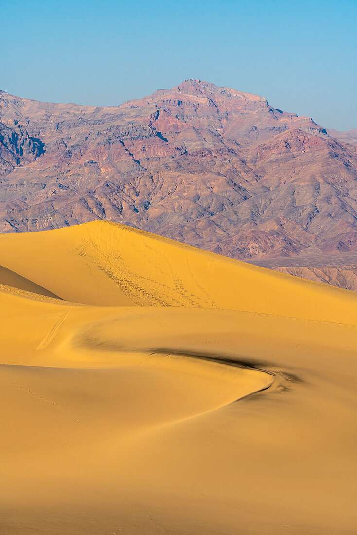 Mesquite Flat Sand Dunes and rocky mountains in desert, Death Valley National Park, California, United States of America, North America