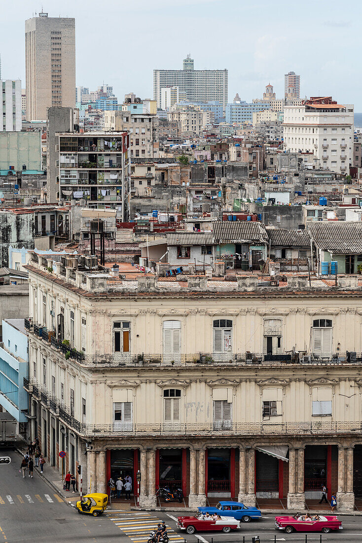 Aerial view of the dividing streets between Modern and Old Havana, classic cars in foreground, Havana, Cuba, West Indies, Caribbean, Central America