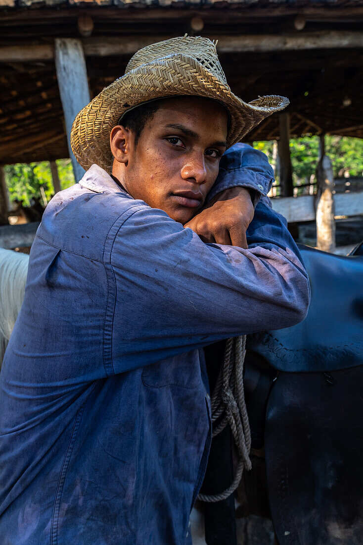 Portrait of a Cowboy at a farm near Trinidad, Cuba, West Indies, Caribbean, Central America